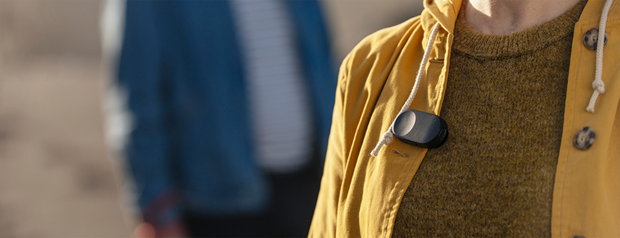 Image of Remote Microphone wireless accessory clipped on to a woman's jacket